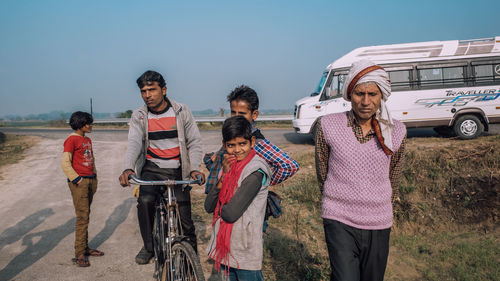 Group of people on bicycle against clear sky