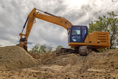 Big excavator with shovel at construction site. horizontal view