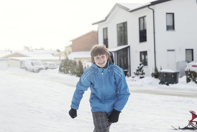 Smiling teenage boy at winter