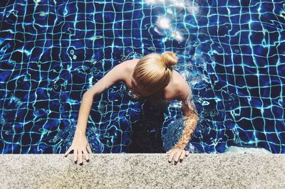 Woman swimming in pool