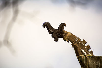 Low angle view of statue against sky