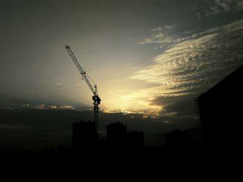 Silhouette cityscape against sky during sunset