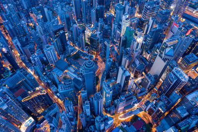 High angle view of illuminated buildings in city at night