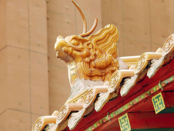 Low angle view of statue against blurred background