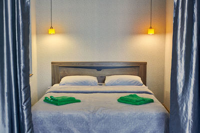 Bedroom with evening light. comfortable hotel bedroom in luxury apartment. cozy, romantic bedroom 