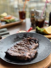 Close-up of meat in plate on table