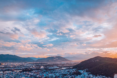 Aerial view of townscape against sky during sunset