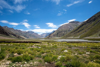 Scenic view of landscape and mountains against sky