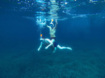 Man swimming in sea