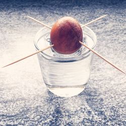 Close-up of fruit on glass