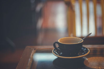 Close-up of coffee cup on table