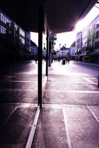 Empty illuminated street in city