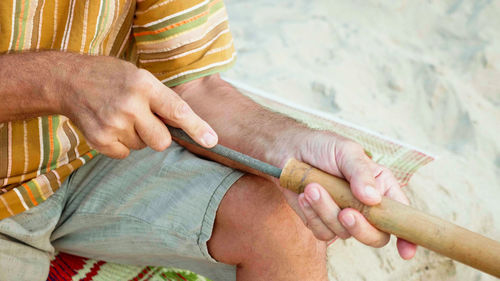 Midsection of woman holding hands