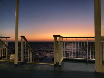 Scenic view of sea against clear sky during sunset