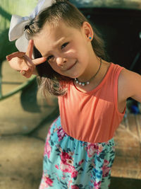 Portrait of cute girl standing outdoors