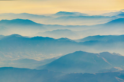 Scenic view of mountain range against sky during sunset