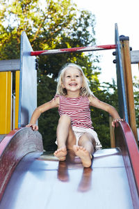 Girl on playground slide, sweden