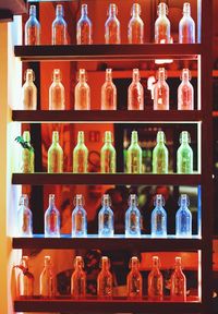 Close-up of bottles in shelf