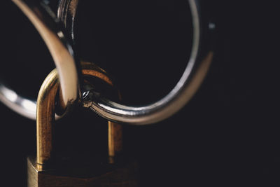 Close-up of padlock on metal