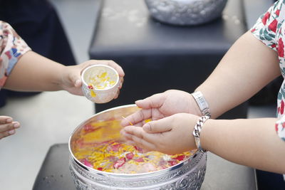 Midsection of woman preparing food