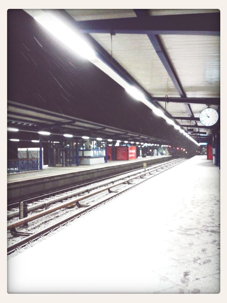 transfer print, indoors, railroad station, railroad station platform, architecture, the way forward, transportation, built structure, auto post production filter, illuminated, subway station, ceiling, diminishing perspective, empty, public transportation, rail transportation, railing, absence, railroad track, lighting equipment