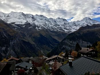 High angle view of houses and mountains against sky