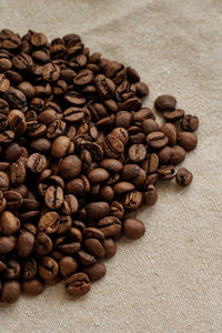 Close-up of roasted coffee beans on table