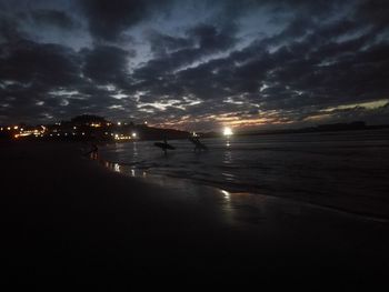 Scenic view of beach against sky during sunset