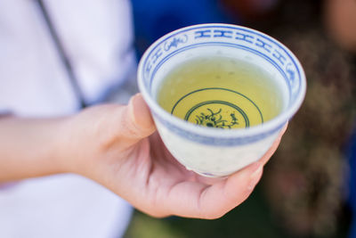 Close-up of person holding drink