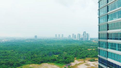 Buildings in city against sky