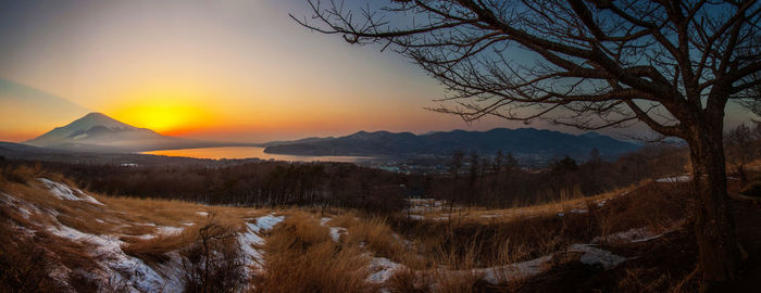 Scenic view of landscape against sky during sunset