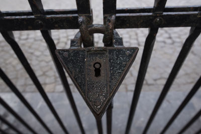 Close-up of padlocks on railing