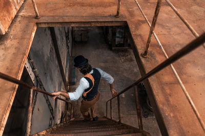 High angle view of man working on building