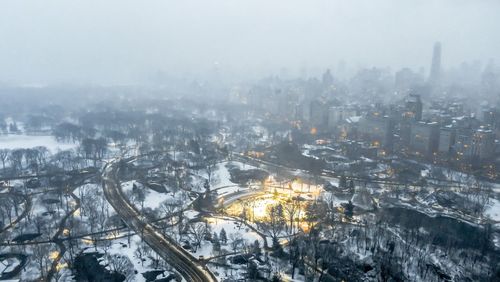 High angle view of city buildings during winter