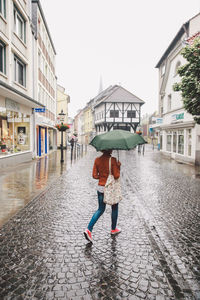 Full length of woman standing in city