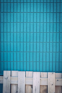 Pallet against blue wall