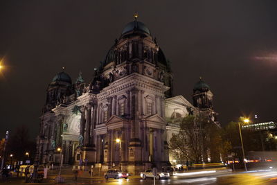 Illuminated cathedral against sky at night