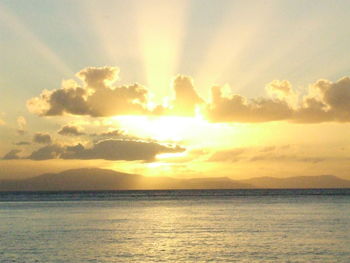 Scenic view of dramatic sky over sea during sunset