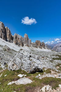 Scenic view of mountains against blue sky