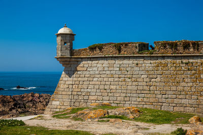 View of fort against blue sky