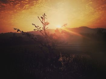 Scenic view of silhouette land against sky during sunset