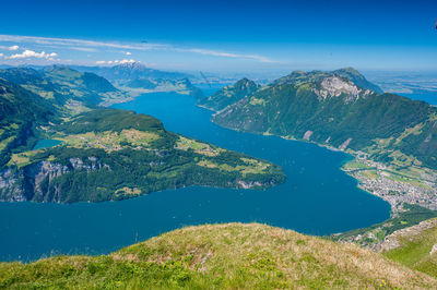 Scenic view of mountains against blue sky