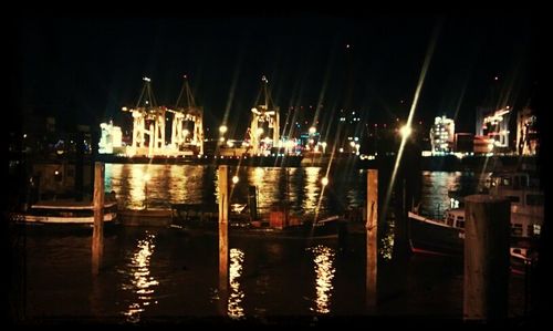 View of illuminated harbor at night