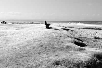 People on beach against sky