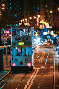 View of illuminated railroad tracks at night