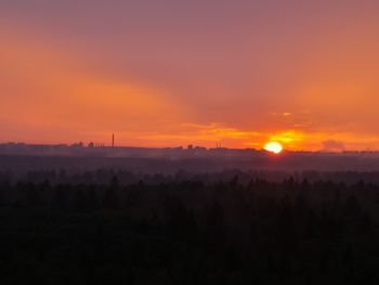 Scenic view of silhouette landscape against romantic sky at sunset