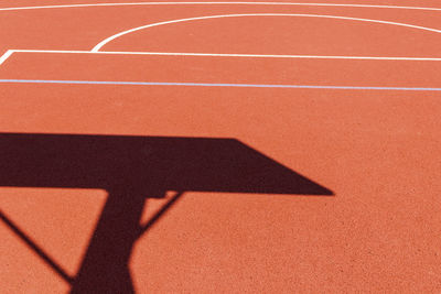 High angle view of shadow of person on zebra crossing