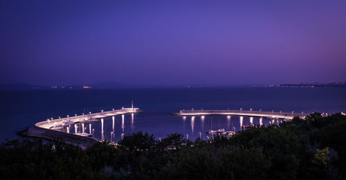 Bridge over river at night