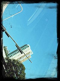 Low angle view of building against blue sky