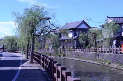 View of buildings by lake